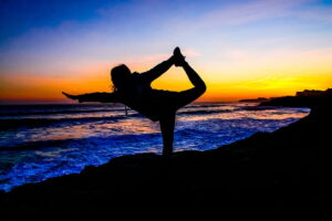 Meditator practicing mindfulness on the tranquil beach at Litchfield Beach in Myrtle Beach