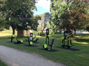 Fitness enthusiasts using an outdoor fitness station at McLean Park, Myrtle Beach, for strength training and exercise